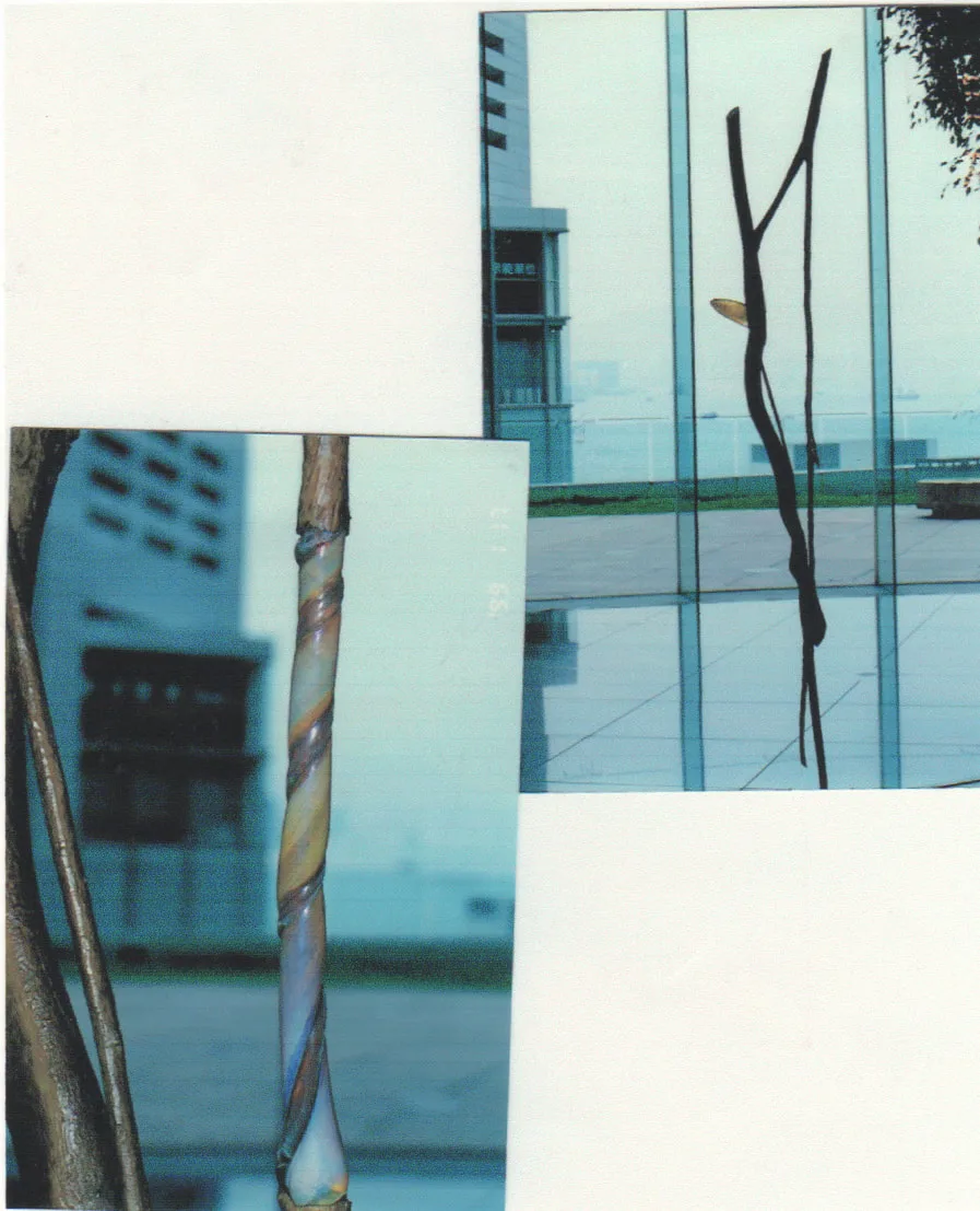 Staff-like bronze sculpture with glass rod