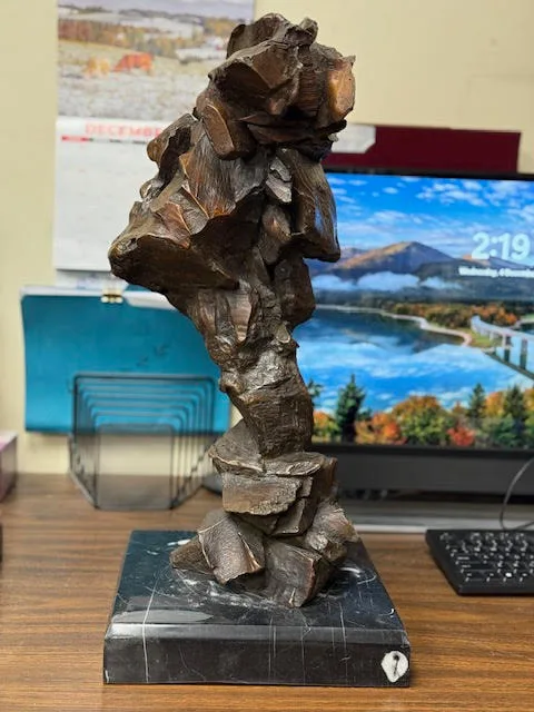 Blocky abstract bronze bust of a Native American