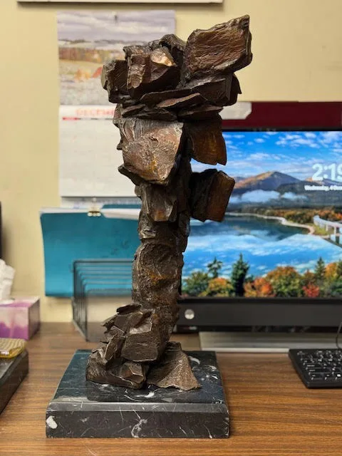 Blocky abstract bronze bust of a Native American