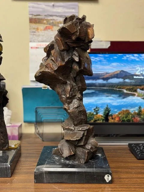 Blocky abstract bronze bust of a Native American