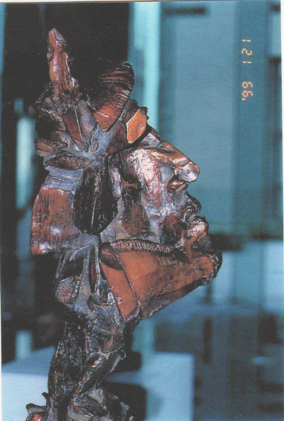 Blocky abstract bronze bust of a Native American