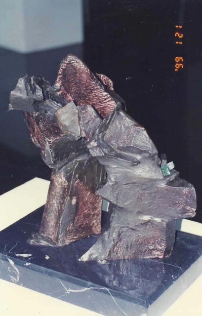 Blocky abstract bronze sculpture of two figures